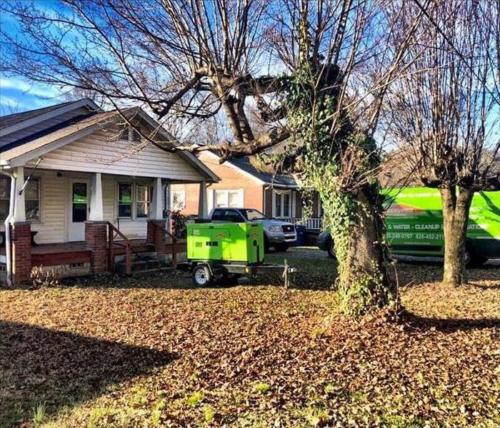 Servpro restoration vehicles parked in front of a Forest City, NC house 